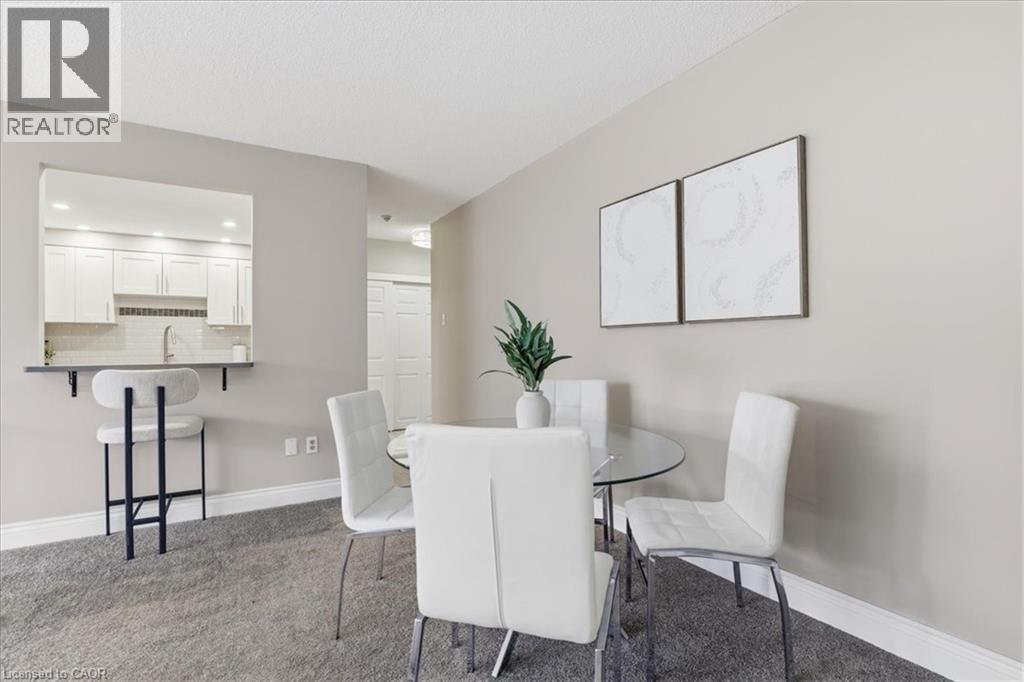 A dining room with a table set for four.