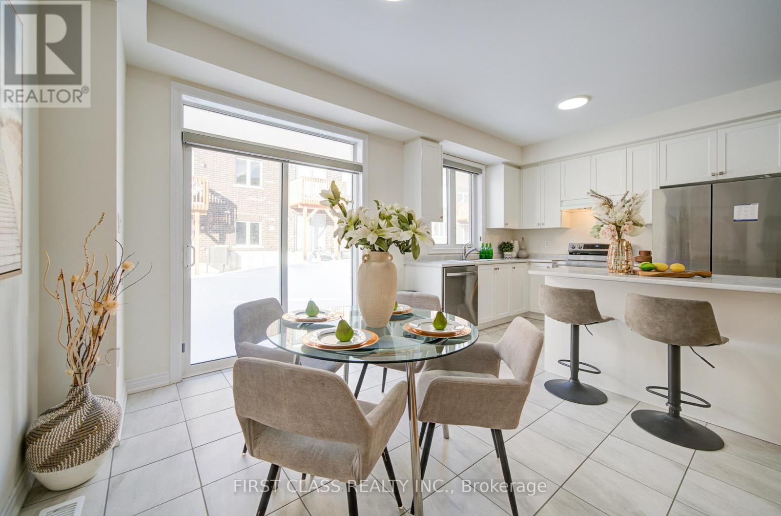 A dining room with a glass table and chairs.