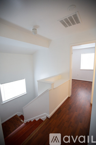 A room with a staircase and a window.