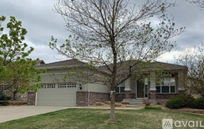A house with a tree in front of it.