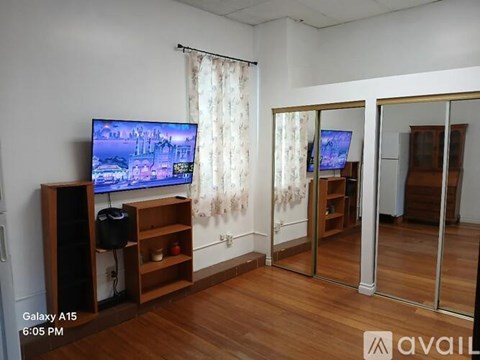 A living room with a television and a speaker.