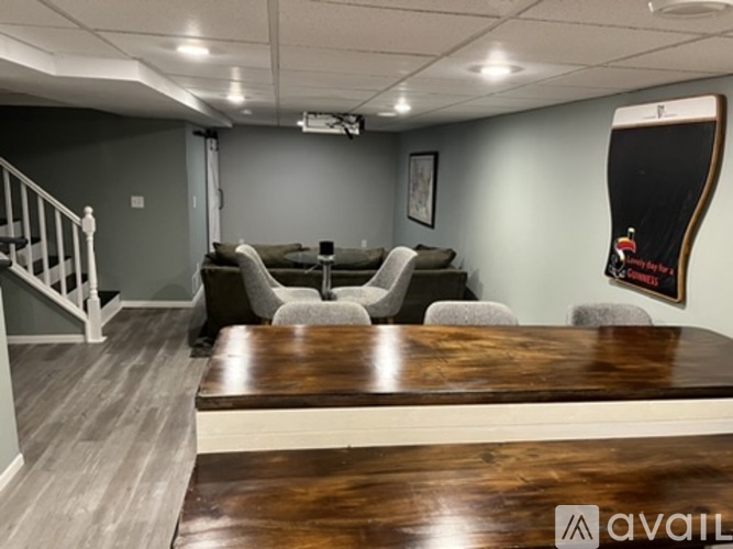 A conference room with a long table and chairs.