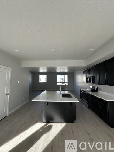 A modern kitchen with a large island in the middle.