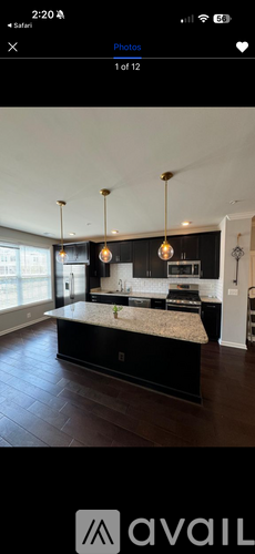 A modern kitchen with a large island in the center.