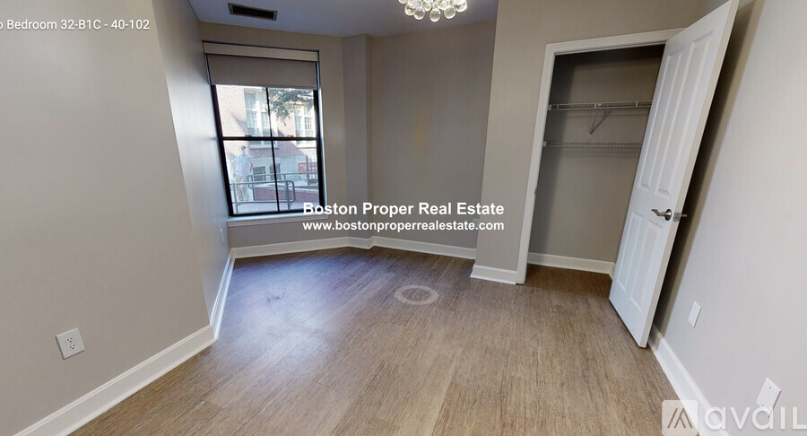 A bedroom with a window and a door is available for rent.