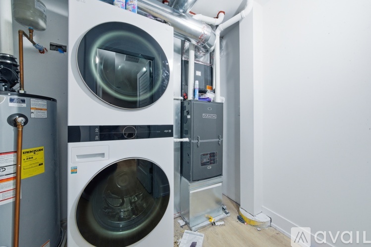 A washing machine and dryer are installed in a wall.