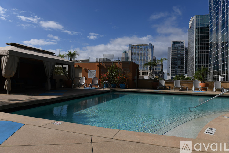 A pool with a view of the city skyline.