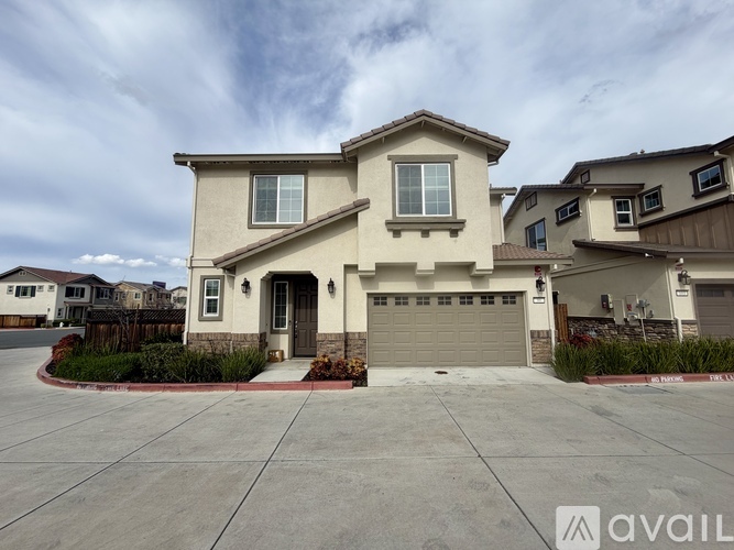 A large house with a garage is available for sale.