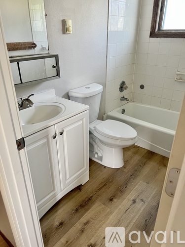 A bathroom with a white toilet and sink.