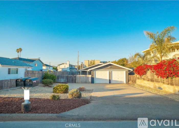 A house with a CRMLS logo in the foreground.