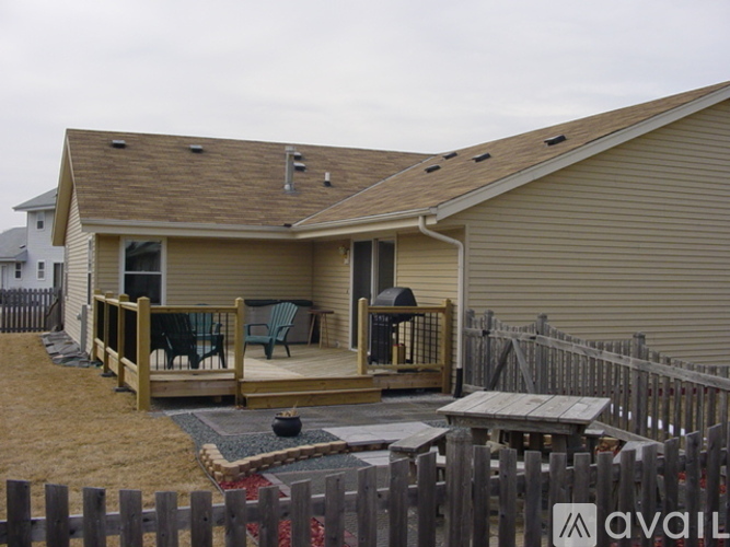 A house with a patio and deck is available for rent.