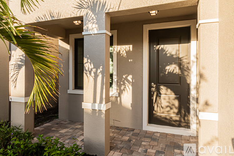 A house entrance with a door and a window.
