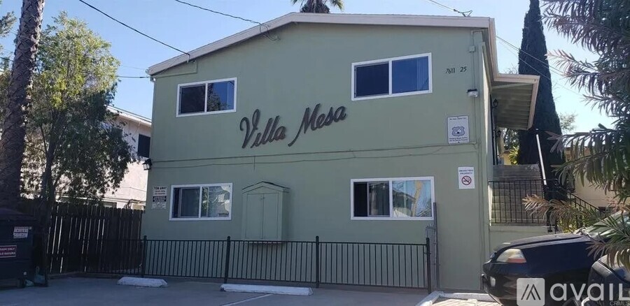 A green building with the words "Villa Mesa" on it.