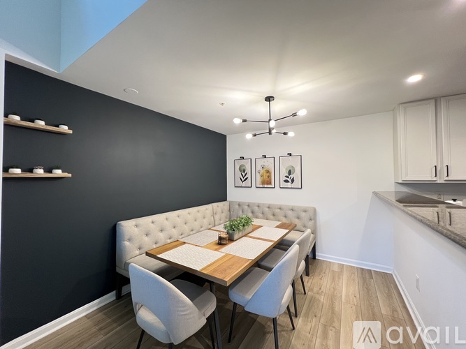 A dining area with a table set for four.
