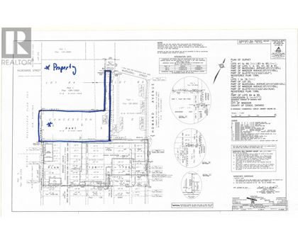 A blue line is drawn on a realtor's floor plan.