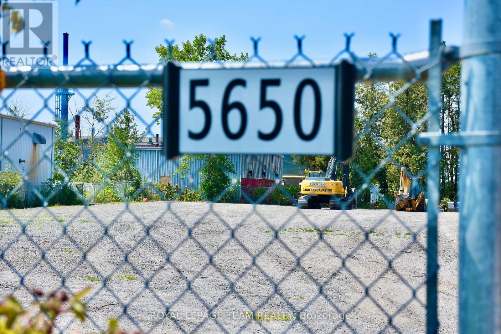 A chain link fence with a sign that reads 5650.