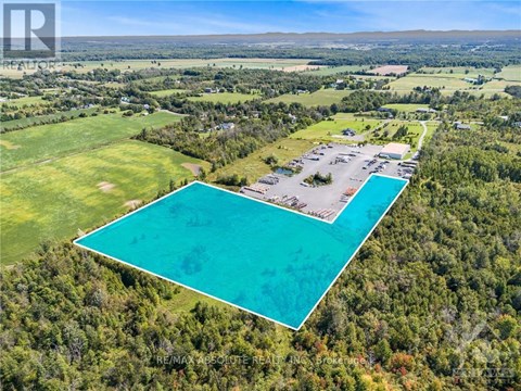 A large swimming pool surrounded by a forest.