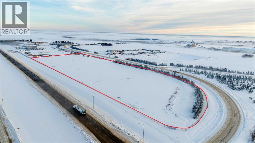A car is driving on a snowy road with a red line on the side.