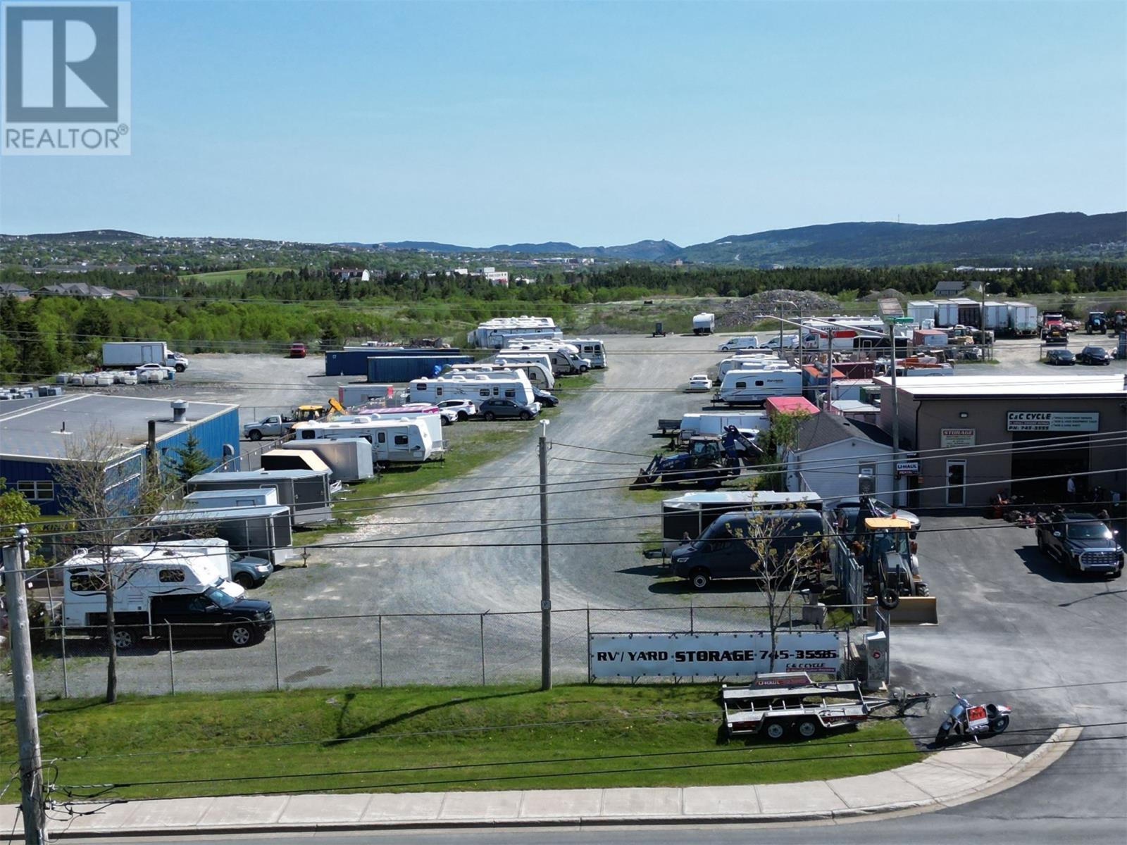 A storage facility with a sign that reads "HVY/ VAR STORAGE 75-3550".