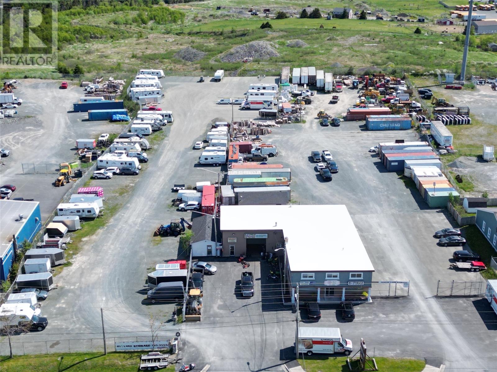 A large industrial area with multiple buildings and vehicles.
