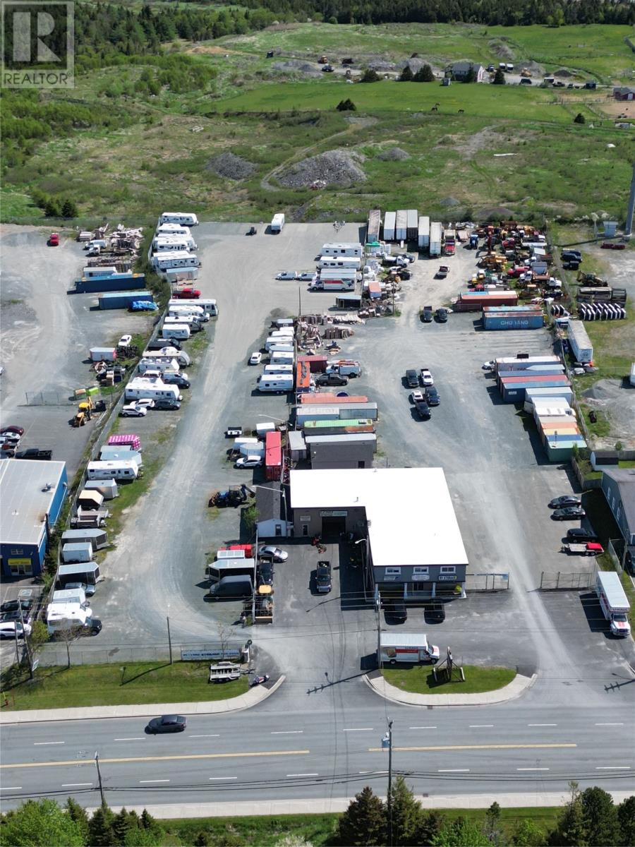 A parking lot with a large number of vehicles.