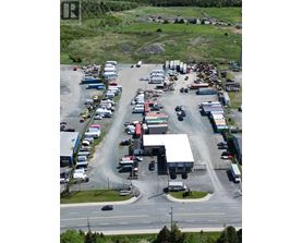 A parking lot with a large number of vehicles.