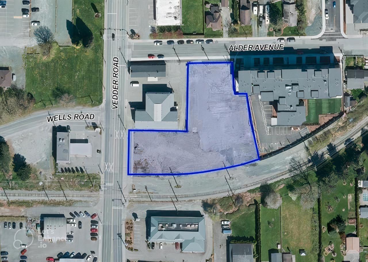 A blue outlined area on an aerial map of a city intersection.