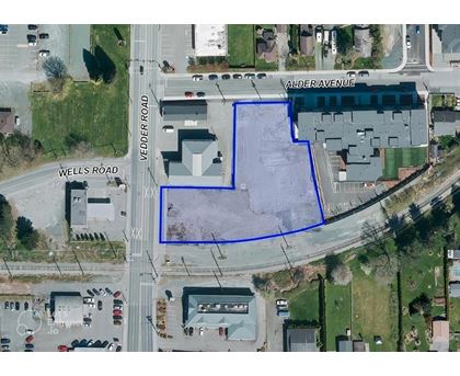 A blue outlined area on an aerial map of a city intersection.