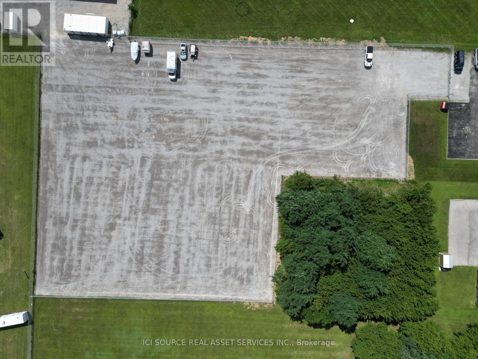 A parking lot with several cars parked in it.