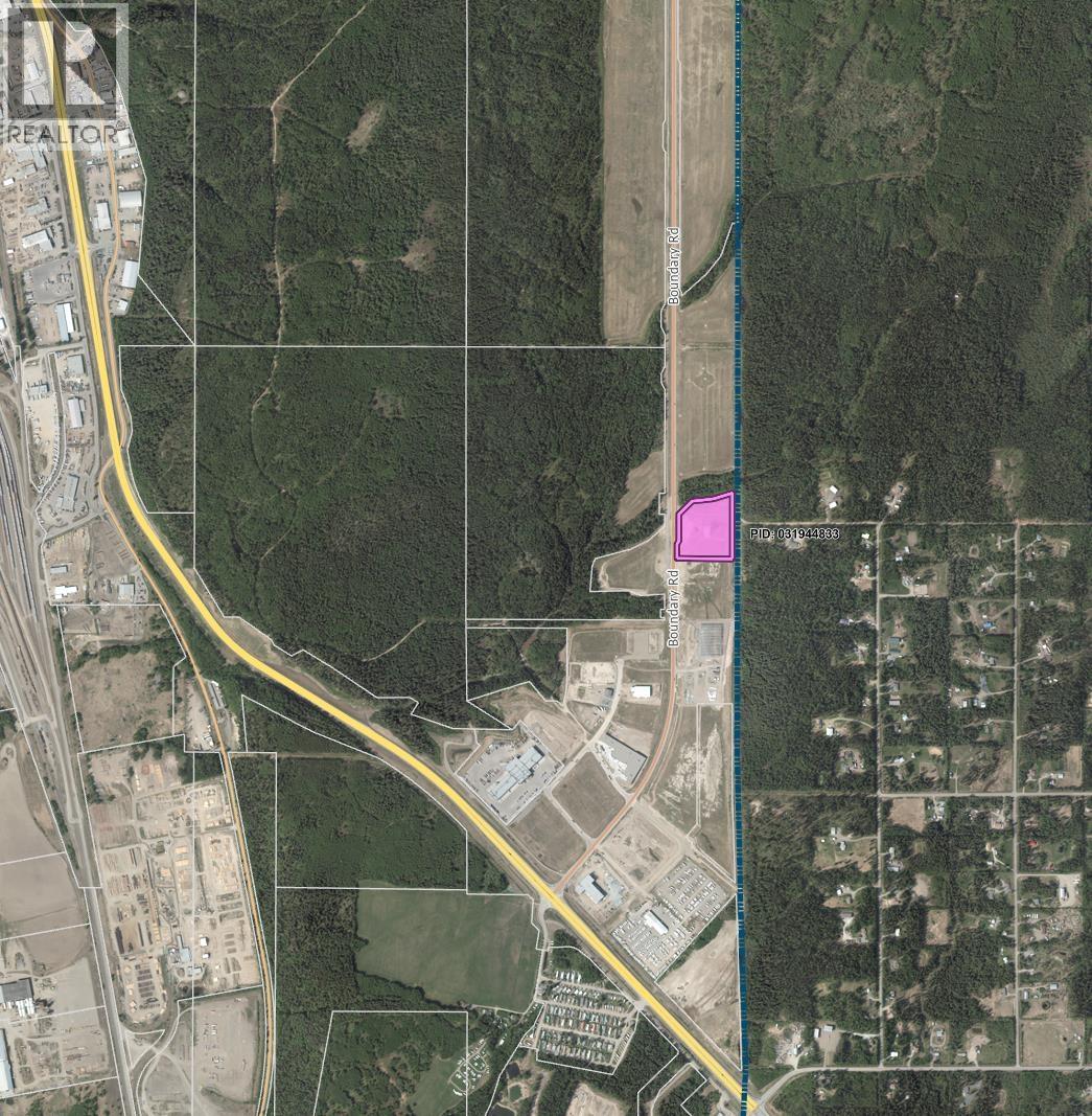A satellite image shows a road passing through a residential area.