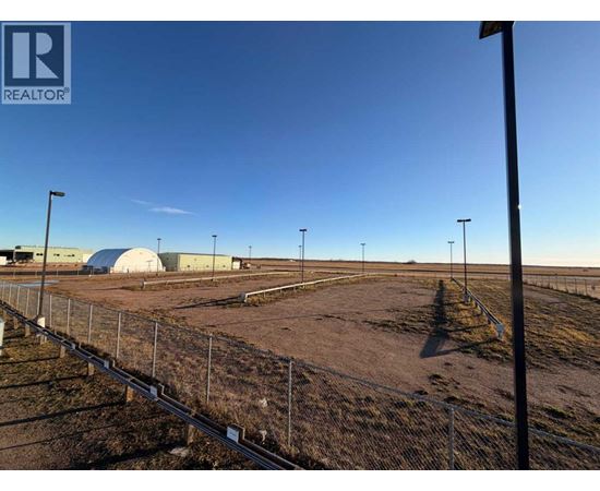 A fenced area with a sign that says REALTOR.