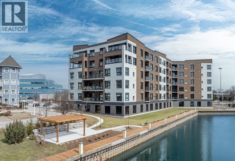 A large building with a body of water in front of it.