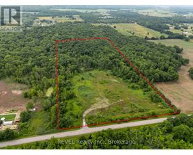 An aerial view of a property with a red outline indicating the boundary.