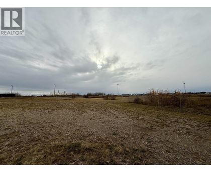 A field with a REALTOR® logo in the corner.