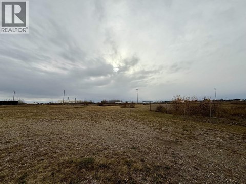 A field with a REALTOR® logo in the corner.
