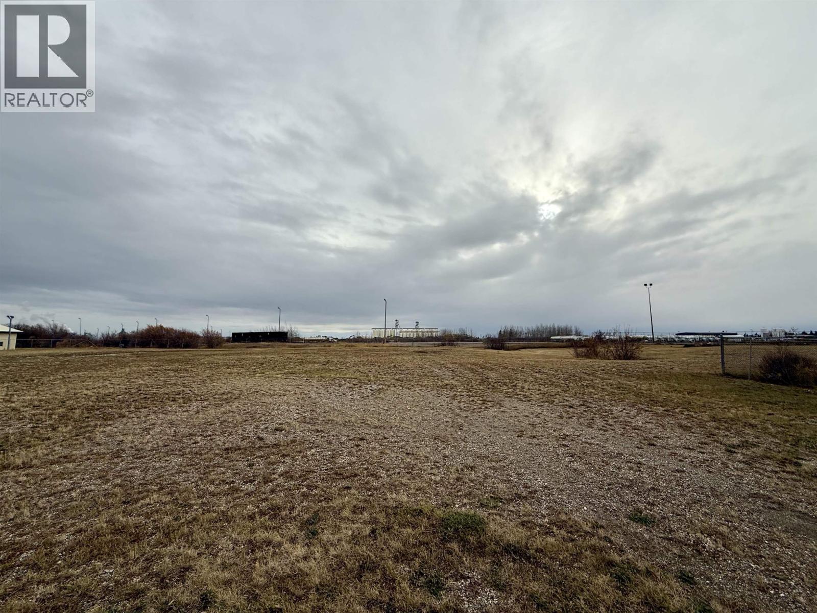 A field with a REALTOR® logo in the corner.