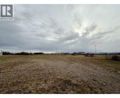 A field with a REALTOR® logo in the corner.