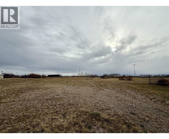 A field with a REALTOR® logo in the corner.