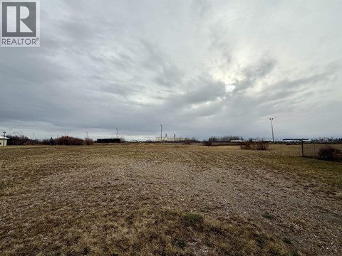 A field with a REALTOR® logo in the corner.