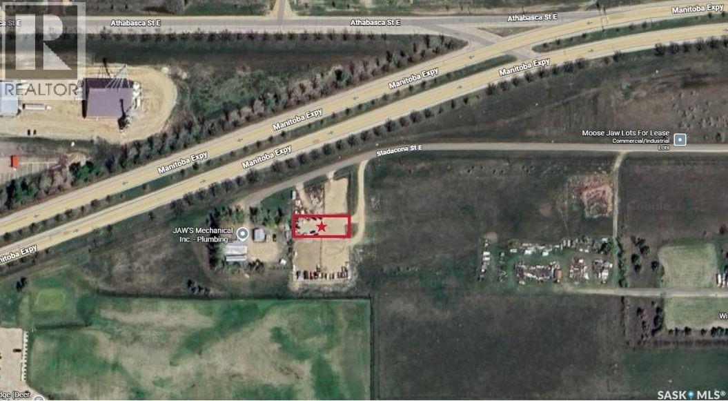 A satellite image shows a realtor's office and a house with a red star on it.