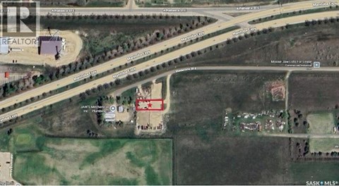 A satellite image shows a realtor's office and a house with a red star on it.