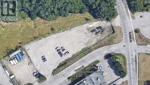 A satellite image shows a parking lot with a sign for Walwin Electrical Services.