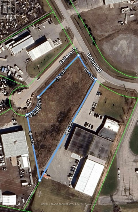 An aerial view of a property with a blue line indicating a boundary.