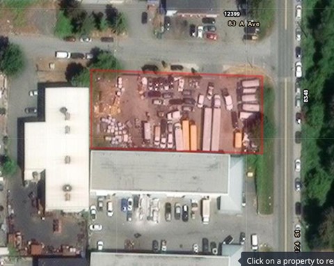 A satellite image shows a property with a red square around it.