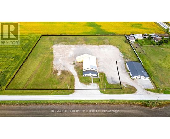 An aerial view of a property with a RE/MAX METROPOLIS REALTY logo.