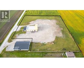 An aerial view of a property with a RE/MAX METROPOLITES REALTY logo.
