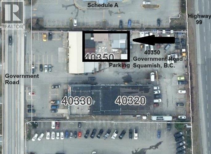 An aerial view of a parking lot with a sign that reads "40350 Government Road Parking Squamish, B.C."