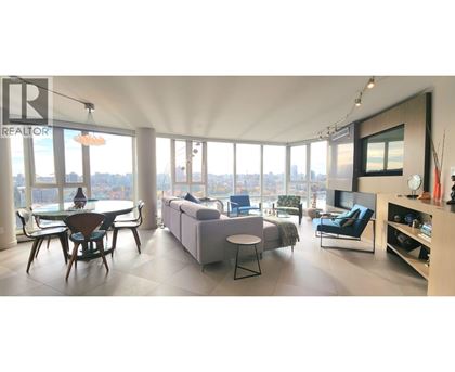 A living room with a dining table and a couch.