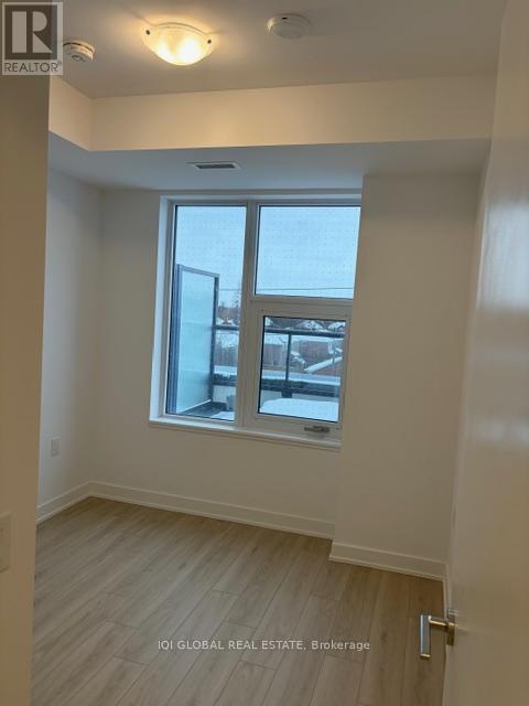A room with a window and a door.