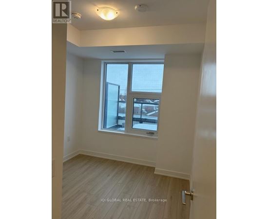 A room with a window and a door.